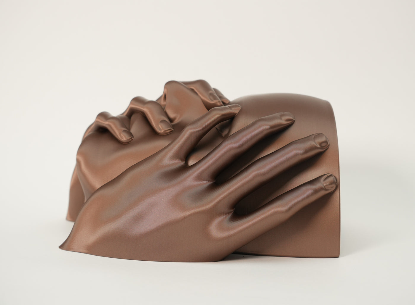 Side view of Echo sculptural wall planter showing hand detail and curved planting pocket