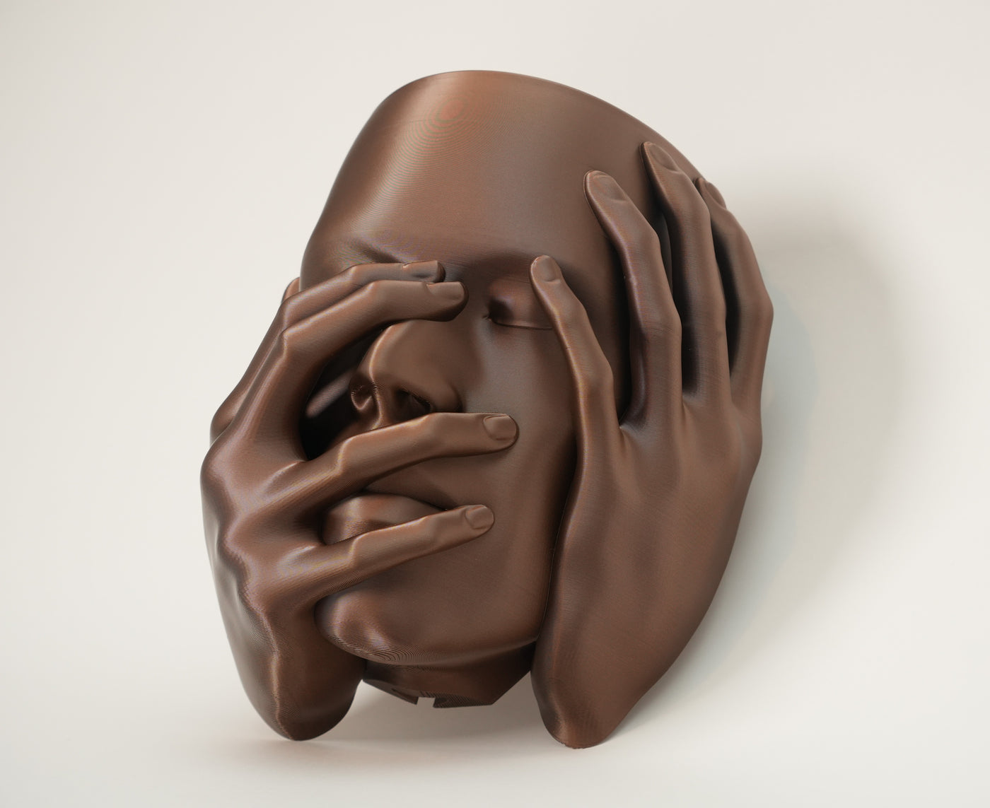 Close front view of Echo wall planter with expressive hand details and face sculpture