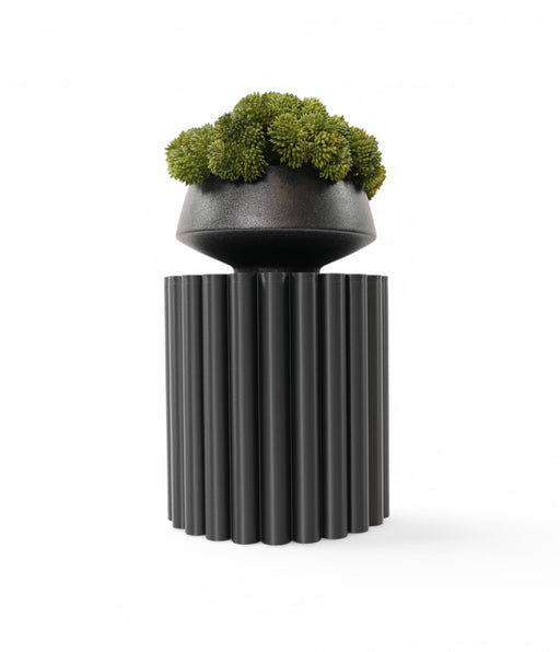 Pillar plant stand in black with small planter and moss displayed on top