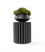 Pillar plant stand in black with small planter and moss displayed on top