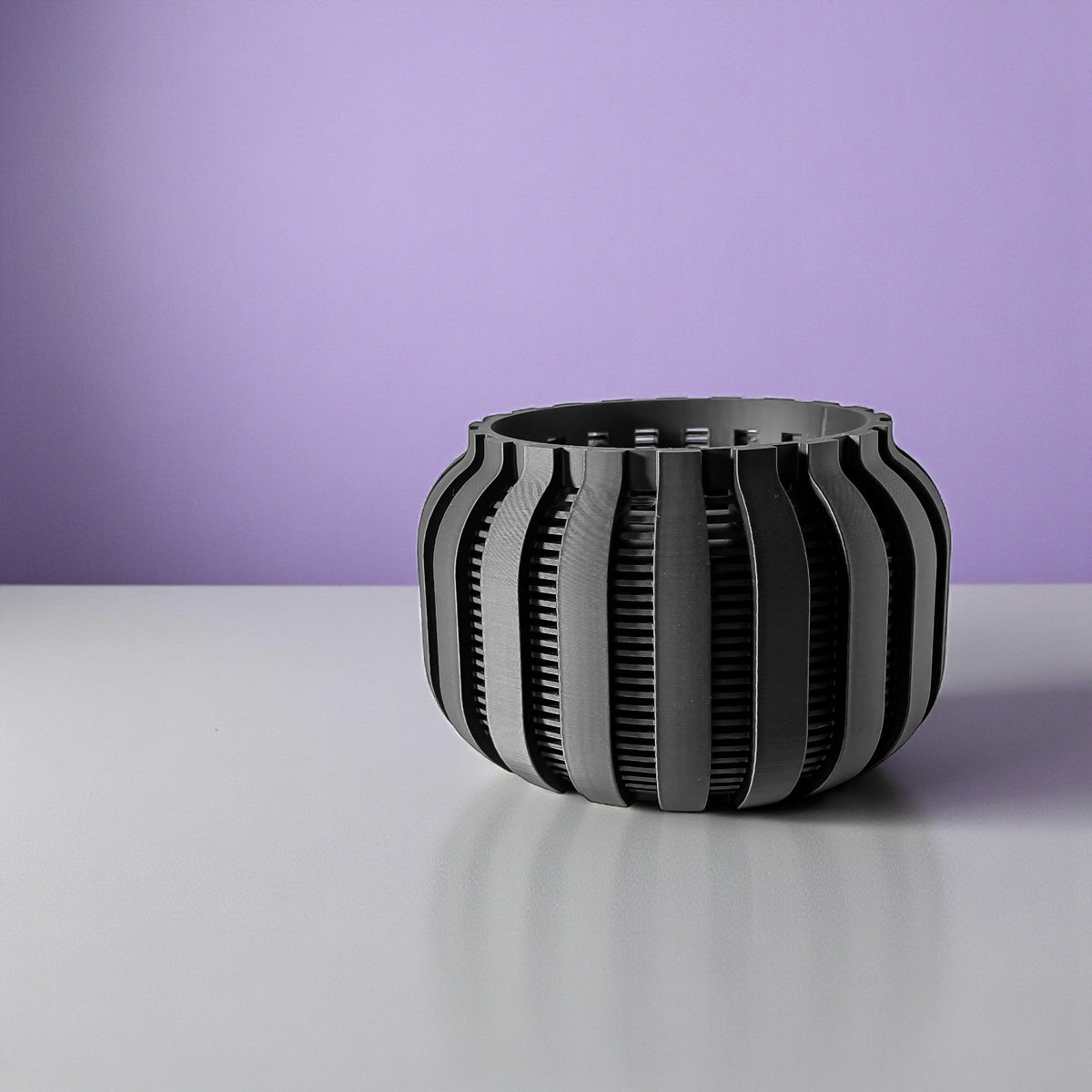 Avix ventilated orchid pot with rounded ribs, empty pot against a purple background