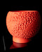 Orange textured planter on a black background