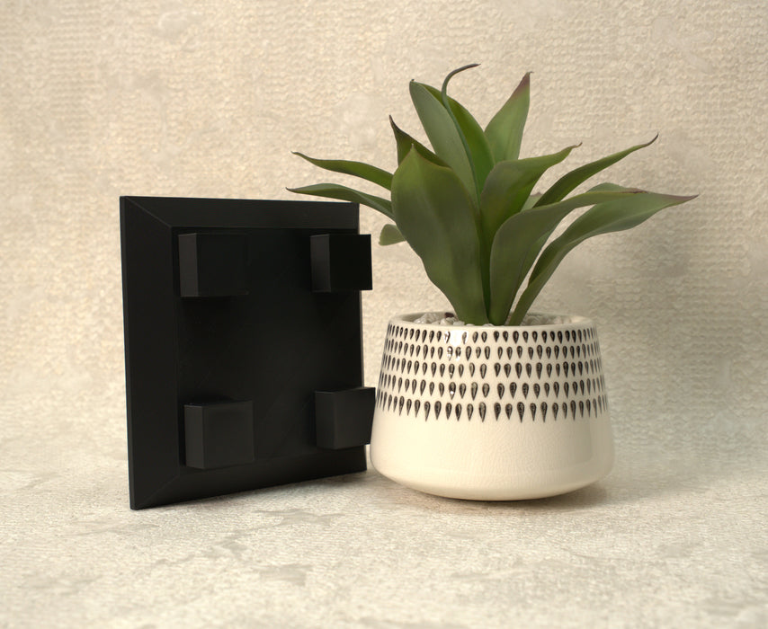 “Nori” plant pot stand shown with indoor planter