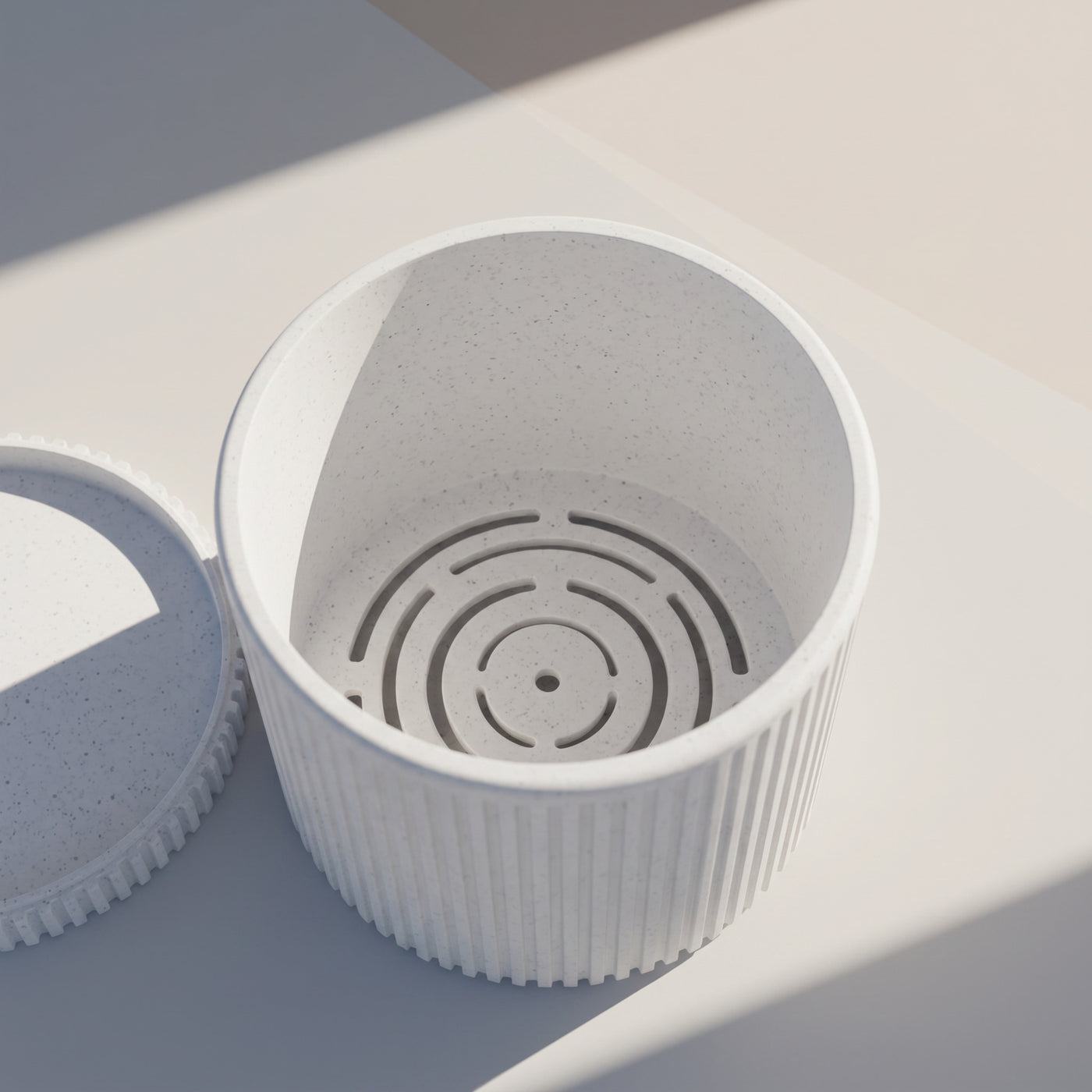Sano even vertical ribs and a clean cylindrical silhouette indoor planter, texture detail