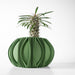 Modern sculptural plant pot with round silhouette and dramatic ridges, 3D printed home decor