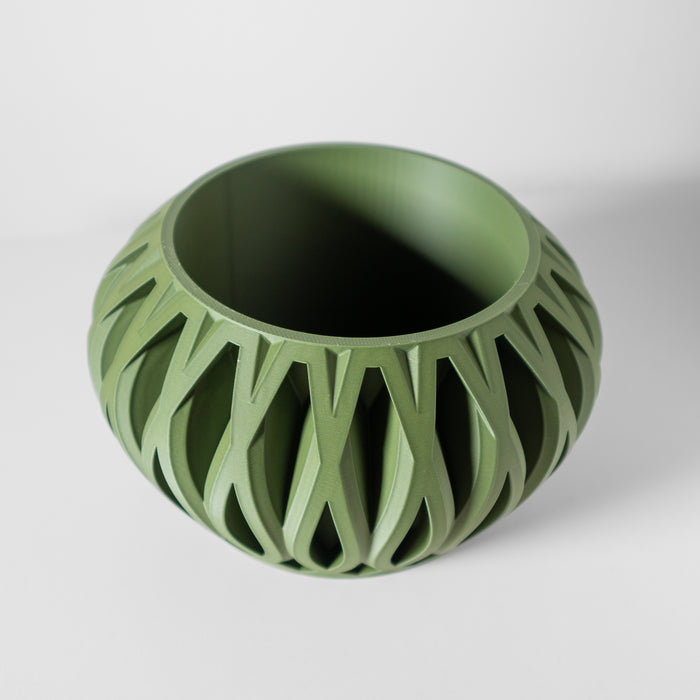 Top view of openwork planter showcasing symmetrical holes and circular planting area, 3D printed design