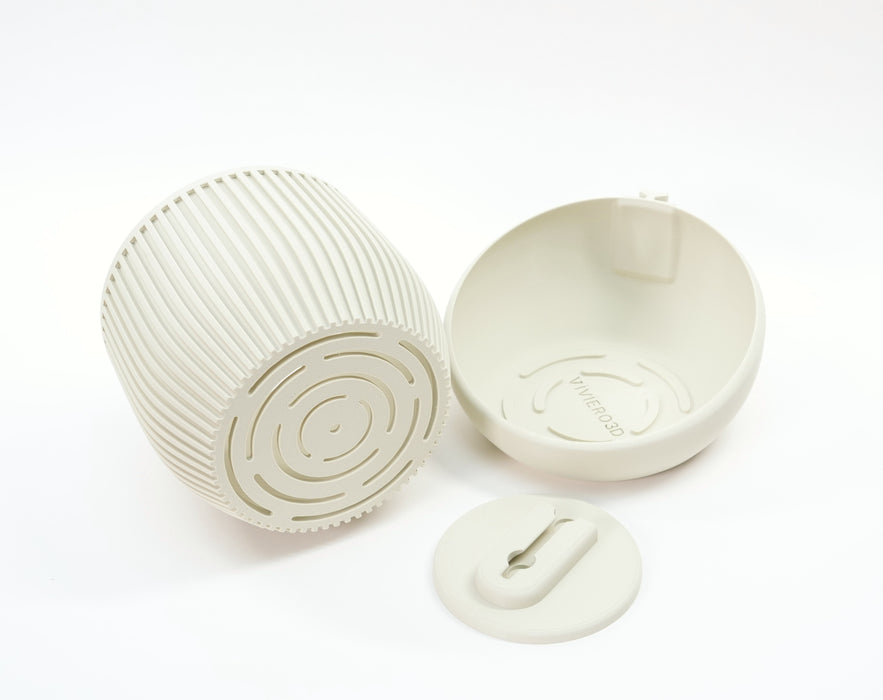 Wall planter “Korin” shown disassembled with planter insert, wall holder, and mounting plate