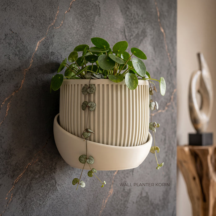 Beige wall planter “Korin” styled with trailing indoor plants on a modern wall