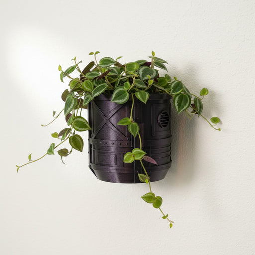 Mech Pod wall planter in Galaxy Fuchsia mounted on wall with trailing plant and industrial sci-fi texture