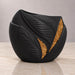 Angled view of Aurelia black planter showing raised leaf veins and gold accents