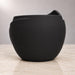 Back view of Aurelia black planter showing its rounded textured body