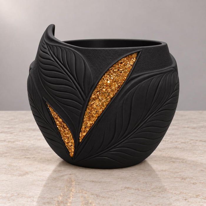 Empty Aurelia black planter showing the leaf relief, gold inlays and planting opening