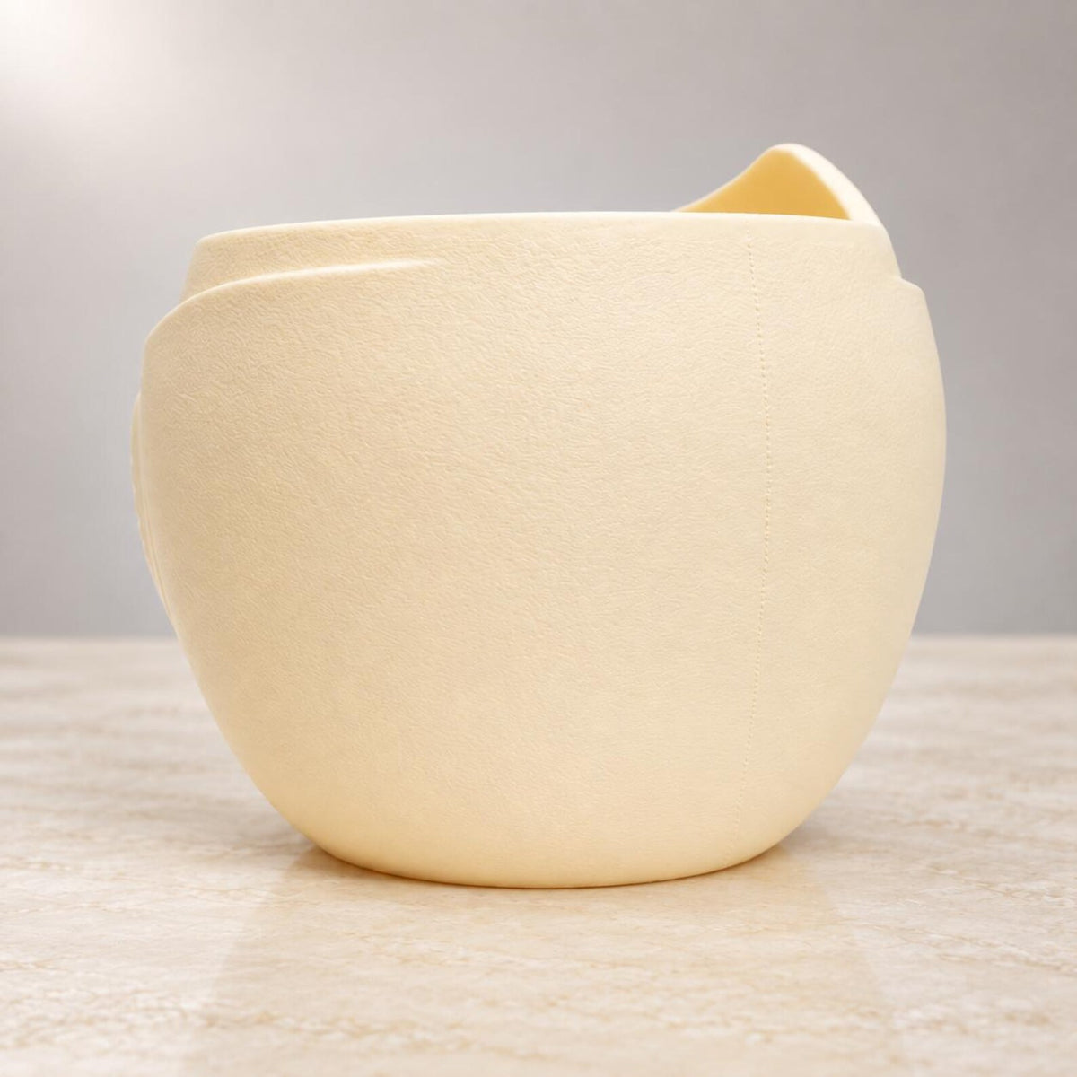 Back view of Aurelia cream white planter showing its rounded form and textured surface