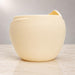 Back view of Aurelia cream white planter showing its rounded form and textured surface