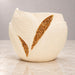 Front view of Aurelia cream white leaf planter with two gold decorative inlays
