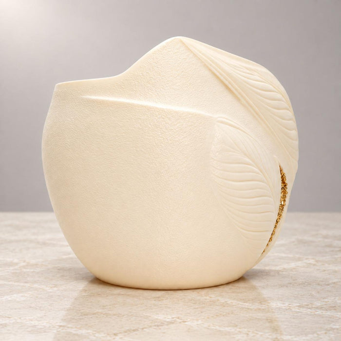 Rear side view of Aurelia cream white planter with sculpted leaf and gold detail