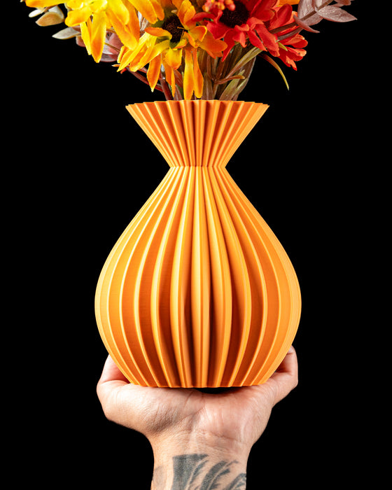 Auri sculptural ribbed vase with flowers, handheld front view