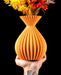 Auri sculptural ribbed vase with flowers, handheld front view