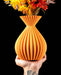 Auri sculptural ribbed vase with flowers, handheld front view