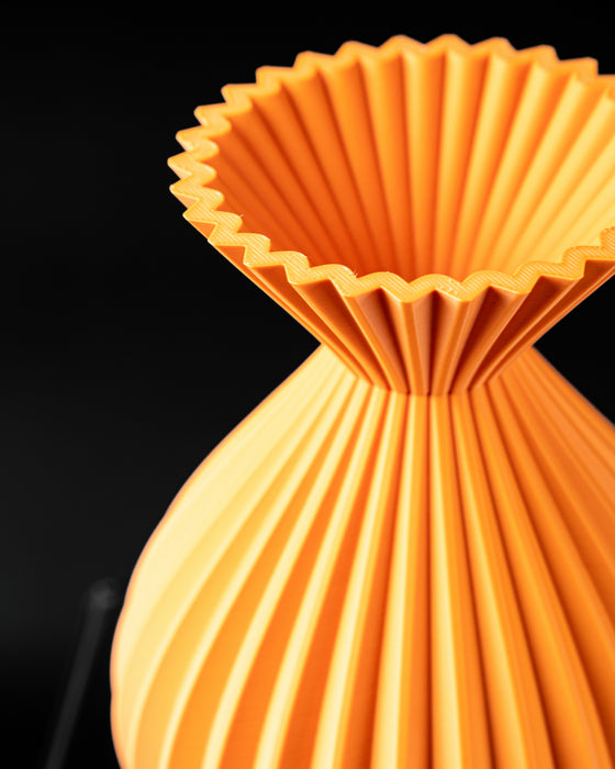 Auri flared-neck vase close-up showing vertical rib texture