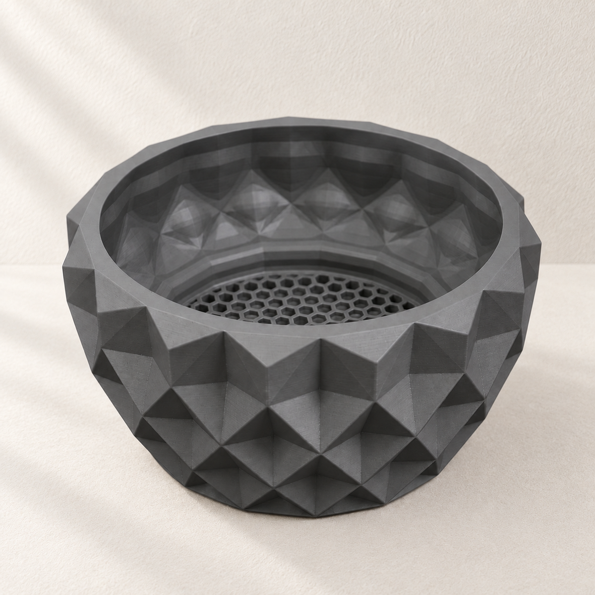 Gray Prizma bonsai bowl viewed from above, showing triangular facets and a perforated drainage base.