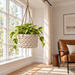 Braido rope hanging planter with trailing foliage displayed in a bright neutral interior