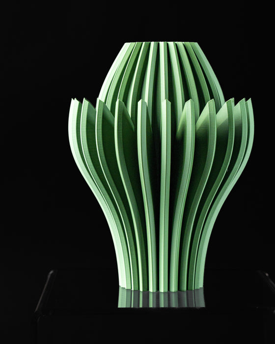 Angled view of Calyra organic sculptural vase with pointed petal fins