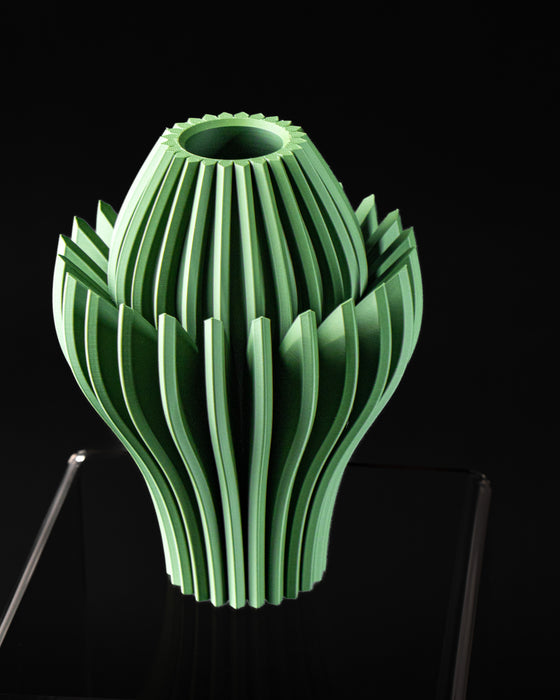 Close view of Calyra bloom vase showing ribbed inner form and leaf-like fins