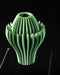 Close view of Calyra bloom vase showing ribbed inner form and leaf-like fins