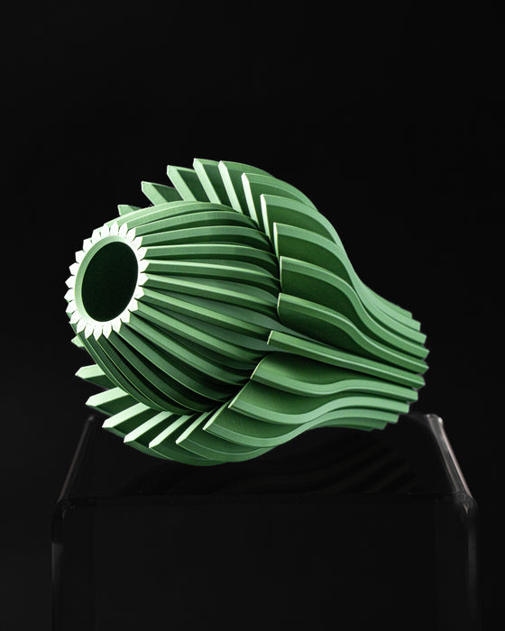 Side view of Calyra sculptural botanical vase with curved pointed petals