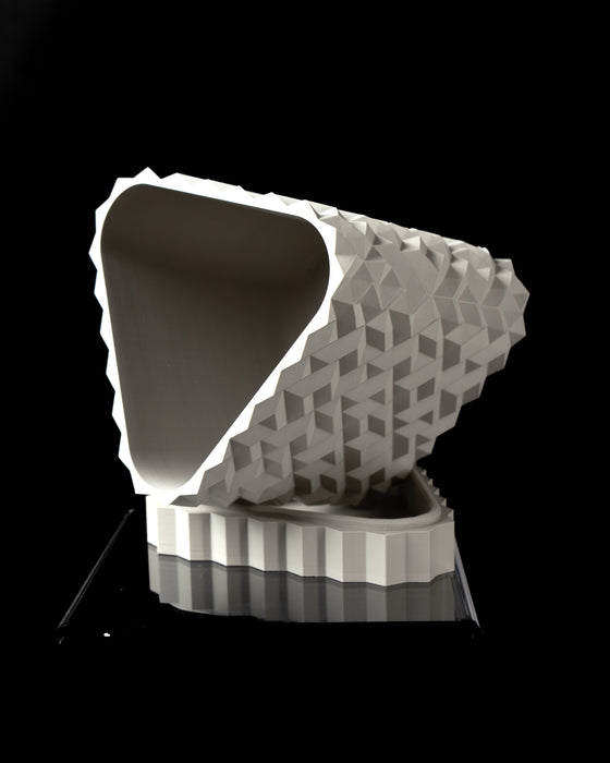 Cobble II planter angled view showing opening and faceted relief