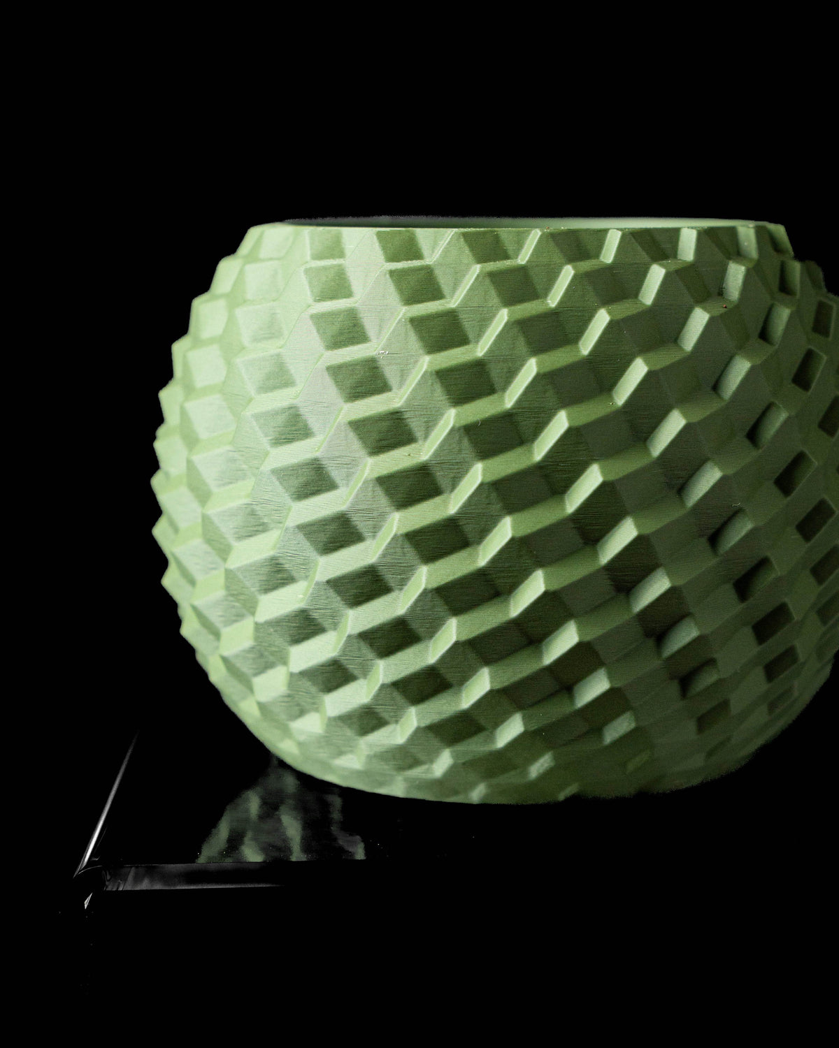 Cobble textured round indoor planter pot, front view