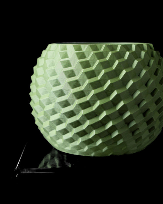 Cobble textured round indoor planter pot, front view