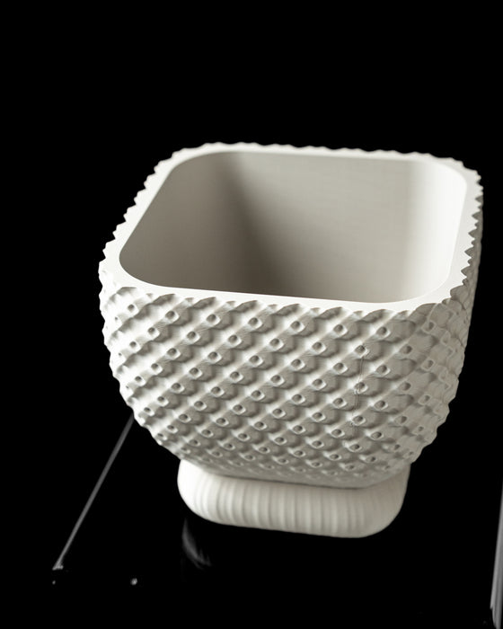 Connect square textured indoor planter pot, angled front view