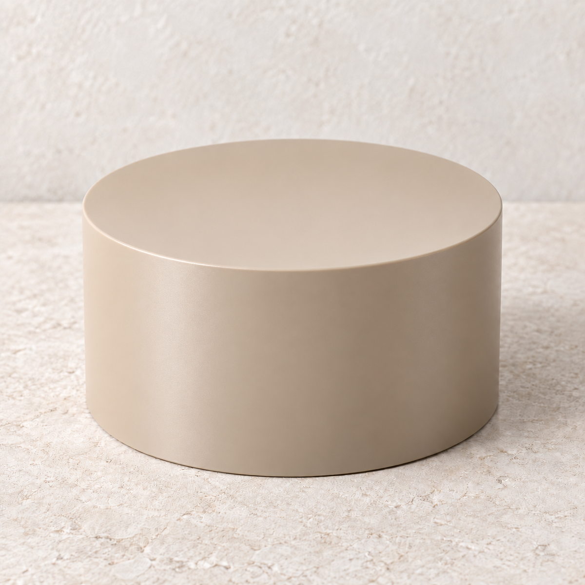 Beige round plant stand with a flat closed top and straight cylindrical sides, shown on a light stone surface.