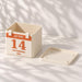 Angled view of the personalized calendar planter beside its removable matching drainage tray.