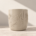 Side of the cream Desert Sunrise planter showing tall cactus relief beside the continuing landscape scene.