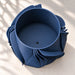 Top view into the Fano planter showing the round planting cavity and drainage opening.