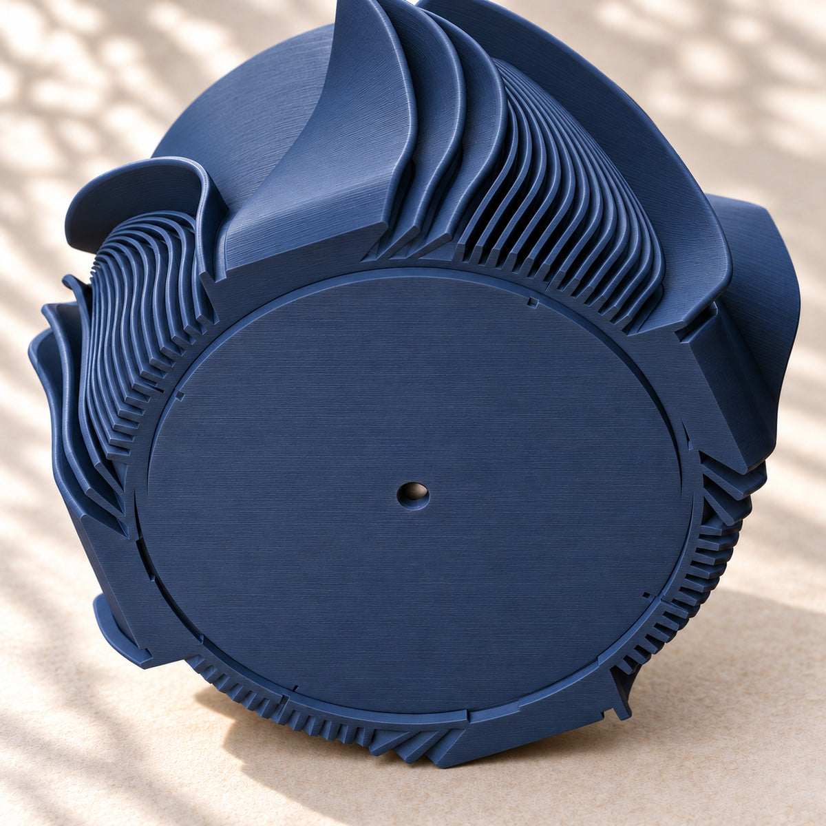 Underside of the Fano drainage planter showing its drainage opening and matching collector connection.