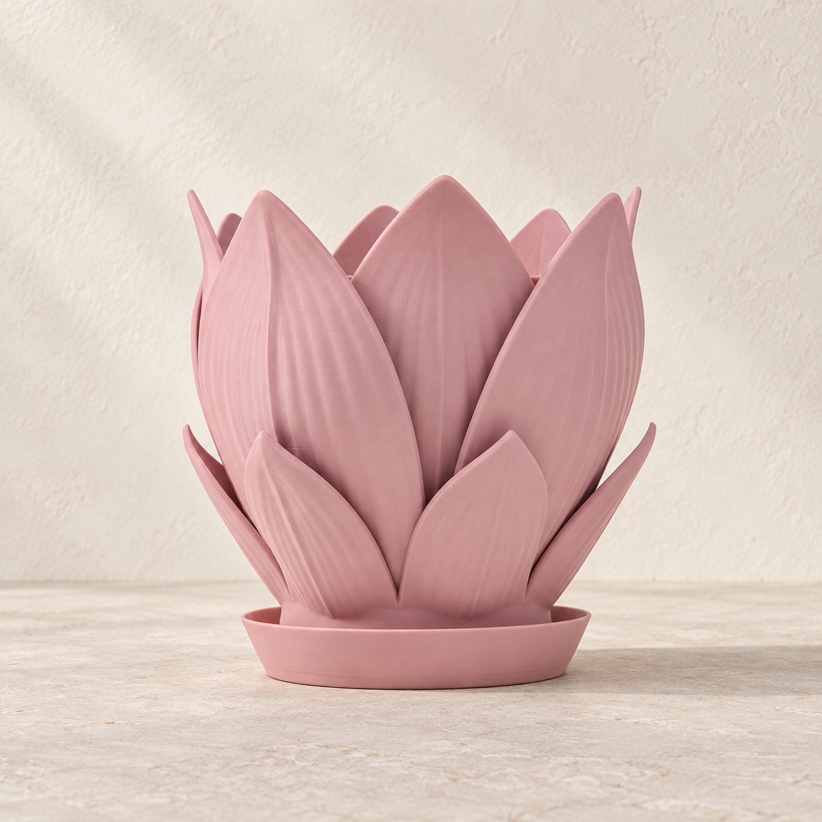 Florenn sculptural planter showing layered petal form around the planting opening across the design