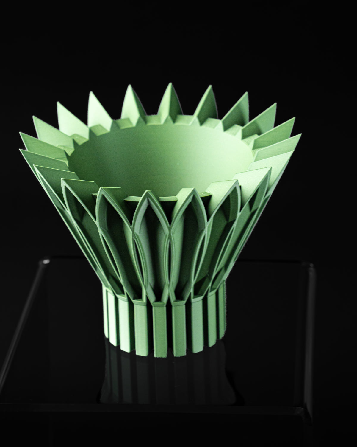 Top angled view of Florix planter showing round planting opening and petal crown