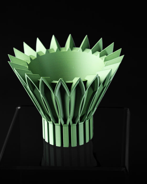Top angled view of Florix planter showing round planting opening and petal crown