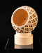 Halo lattice globe planter tilted view showing smooth inner vessel
