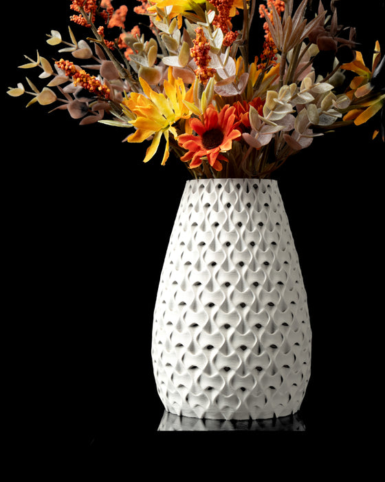 Inter openwork vase styled with dried flowers