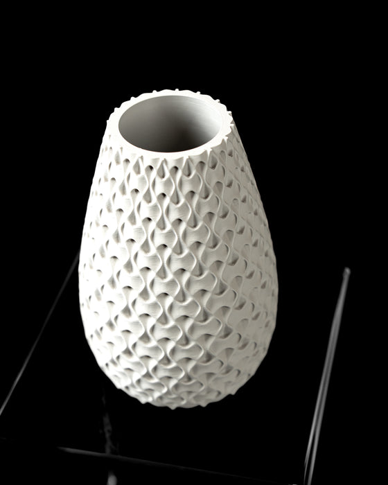Inter sculptural vase angled view showing narrow opening