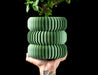 Koro ribbed LUX planter with plant, styled with multiple planters