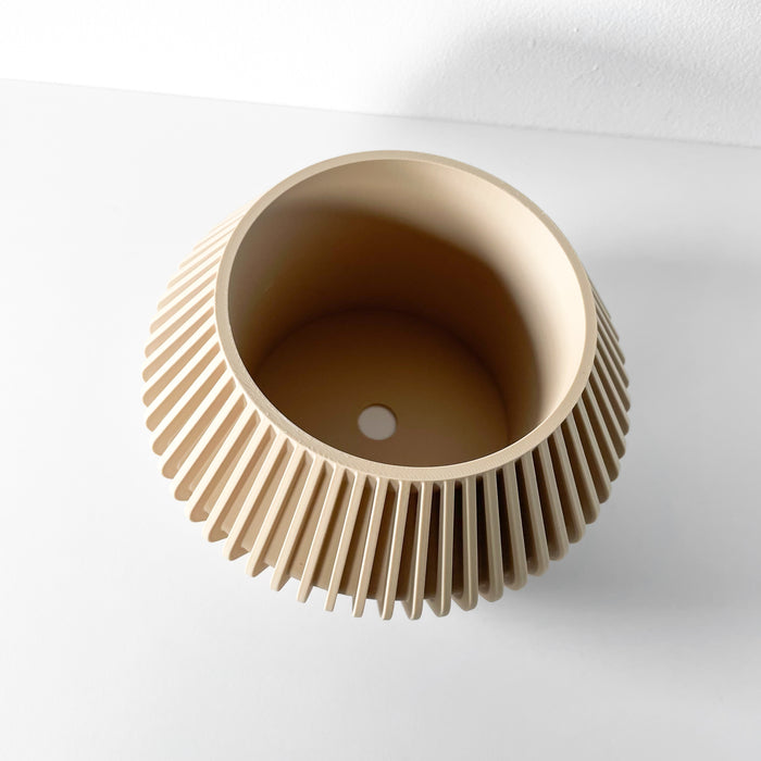 Overhead view of ribbed beige planter with drainage hole | modern tabletop flower pot for home and office