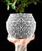 Nexis round planter with smooth inner vessel and irregular cellular ribs