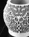 Detail view of Nexis planter showing sculptural cellular texture and base