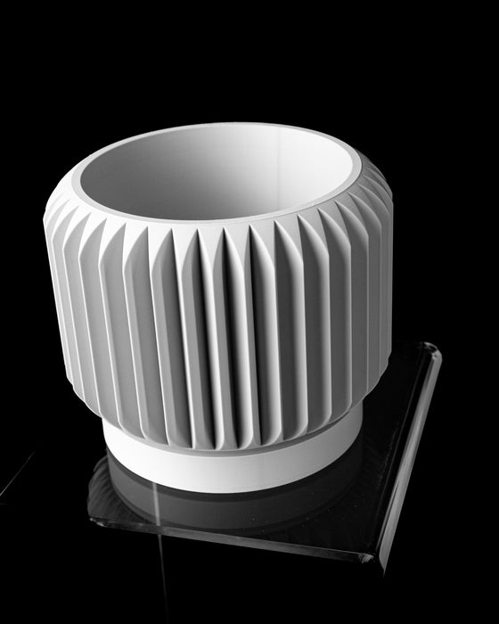 Nila round pedestal planter angled view showing planting opening